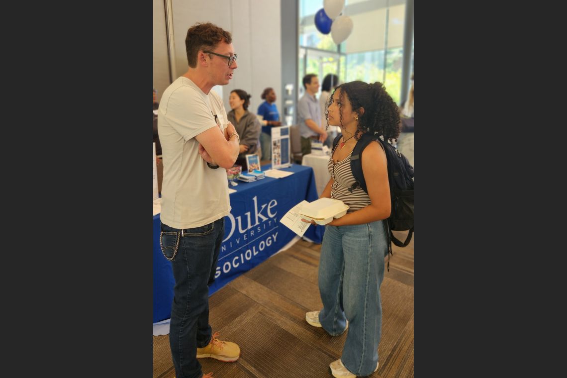 Prof. Chris Wildeman in conversation with a student 